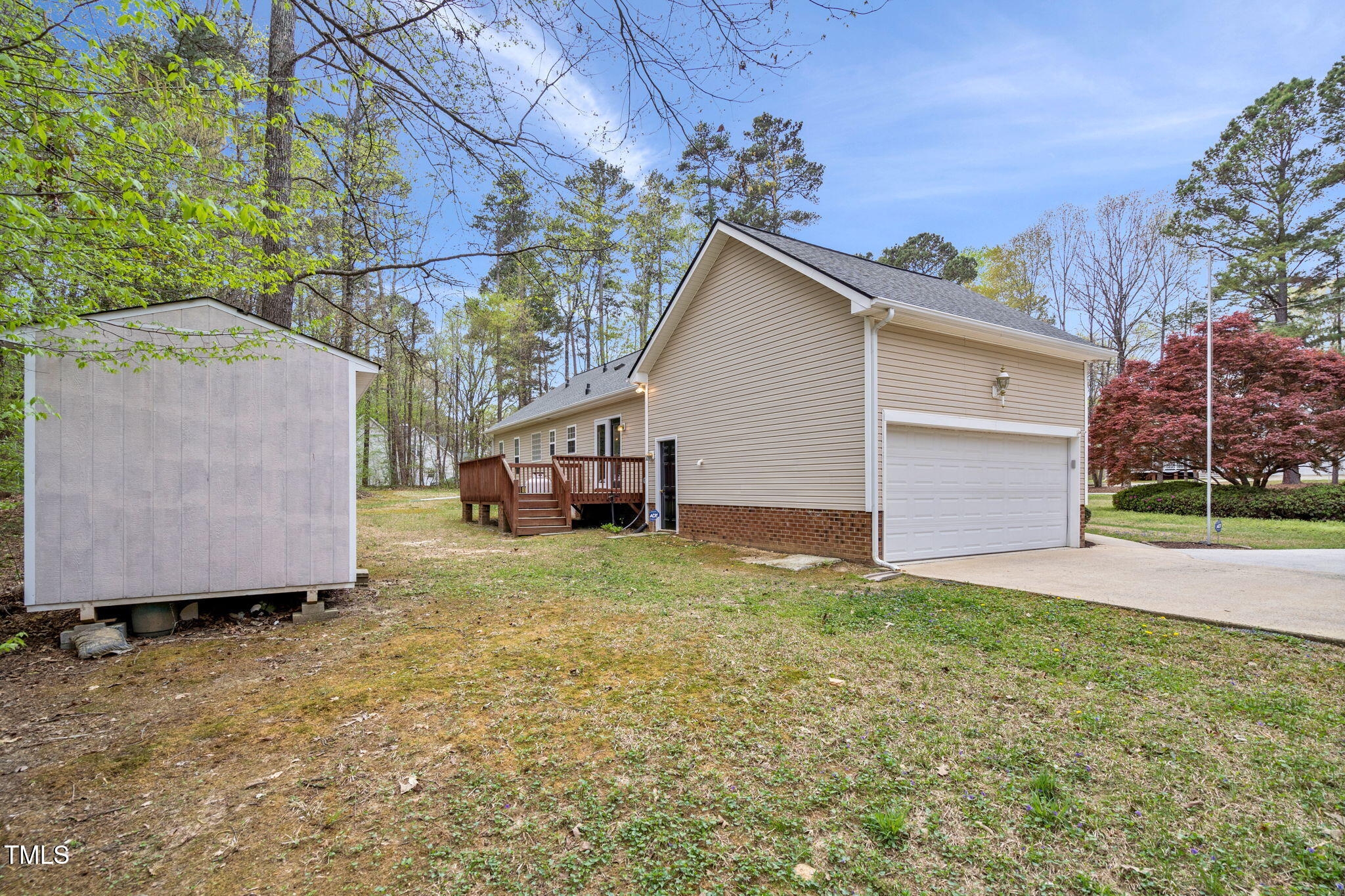 340 Castleberry Road Clayton, NC 27527 - Photo 27 of 31 a view of a house with a yard and garage