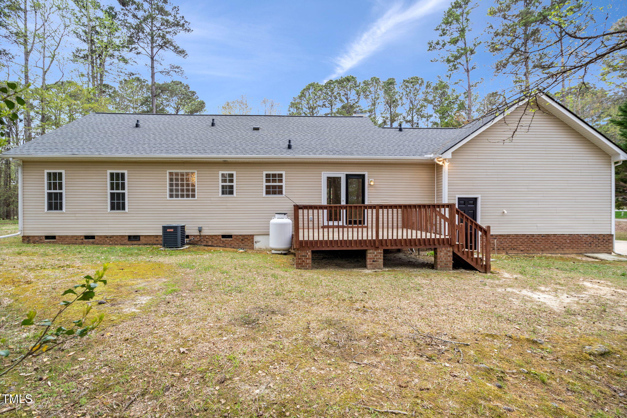 340 Castleberry Road Clayton, NC 27527 - Photo 28 of 31 a view of a house with pool lawn chairs and a yard