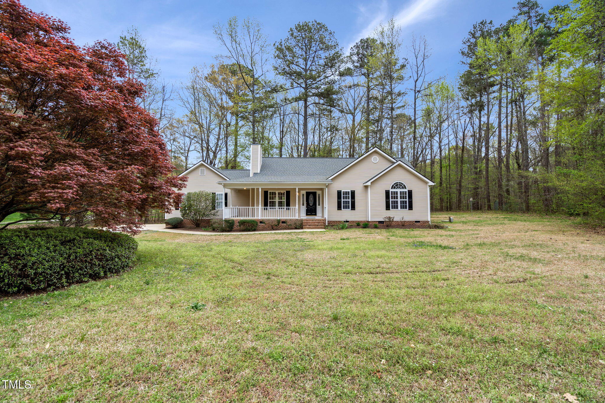 340 Castleberry Road Clayton, NC 27527 - Photo 2 of 31 a front view of a house with garden