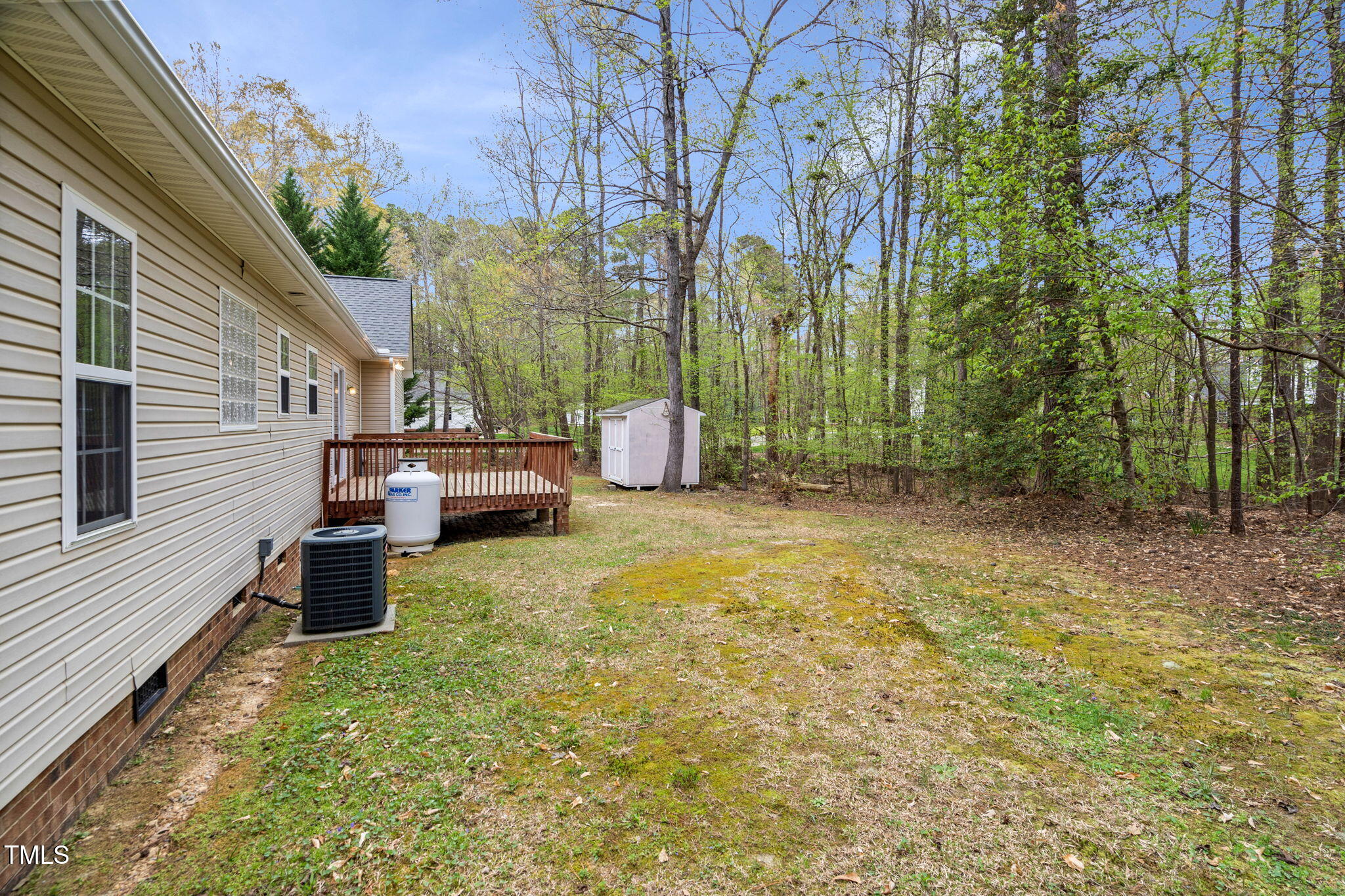 340 Castleberry Road Clayton, NC 27527 - Photo 30 of 31 a backyard of a house with table and chairs
