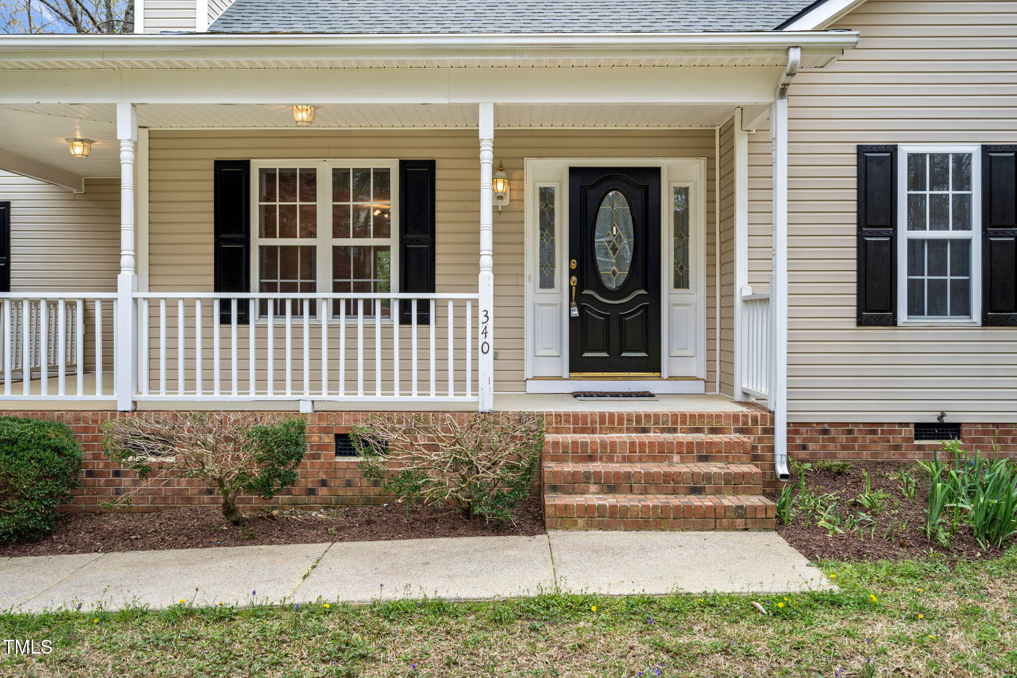 340 Castleberry Road Clayton, NC 27527 - Photo 5 of 31 a view of a house with a yard