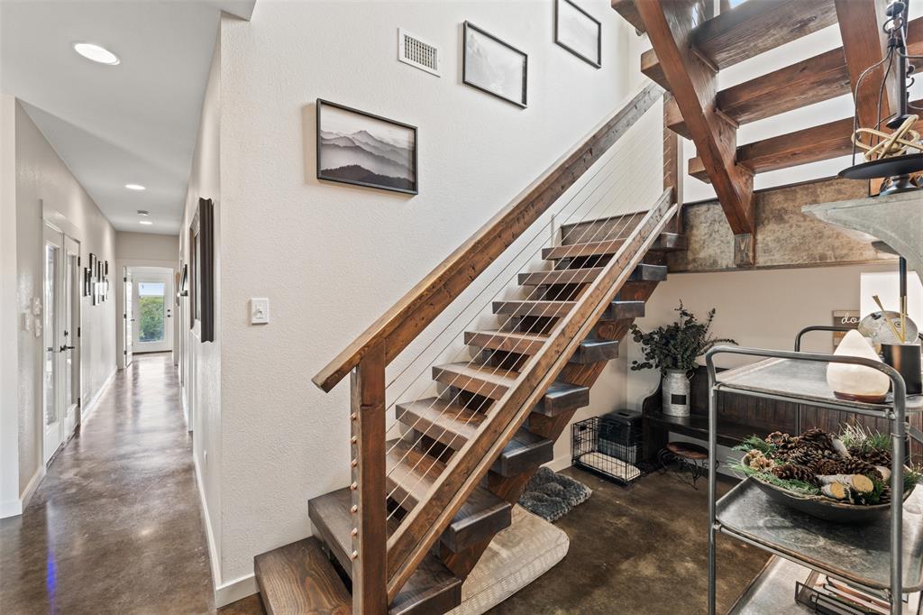 124 Bluffview Circle China Spring, TX 76633 - Photo 16 of 40 Open-tread staircase with wood-finish treads and cable railing