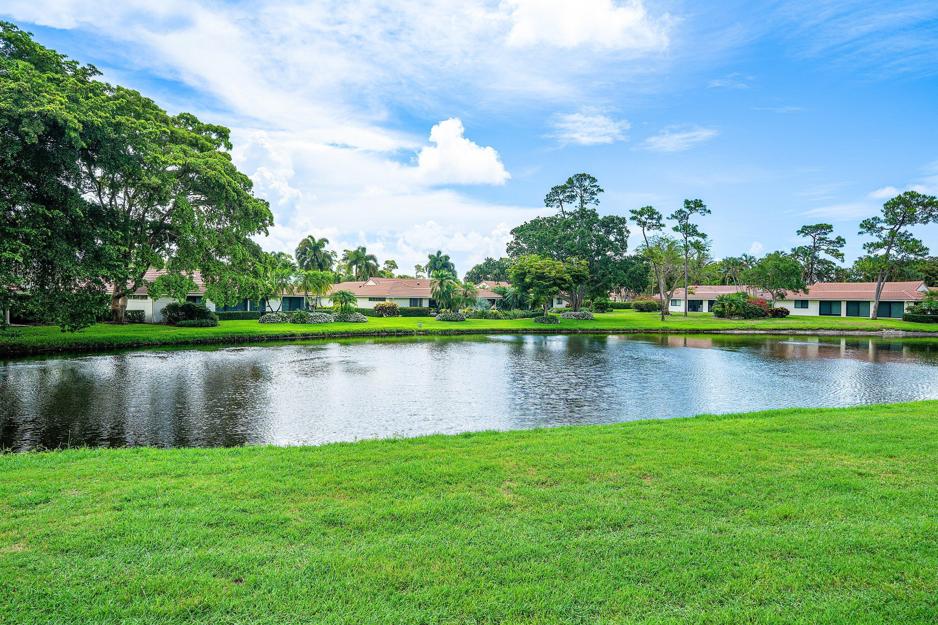 4365 Shell Drake Lane Boynton Beach, FL 33436 - Photo 31 of 56 a view of a lake with a city