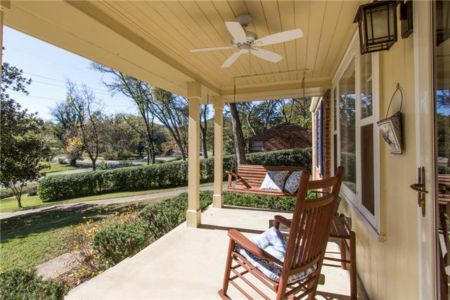 636 Hogan Road Nashville, TN 37220 - Photo 2 of 14 Swing your troubles away on this fantastic covered front porch!
