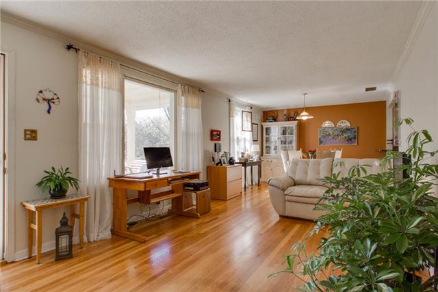636 Hogan Road Nashville, TN 37220 - Photo 3 of 14 The living room/dining room combination is flooded in beautiful natural light. Notice the large, newer picture window.