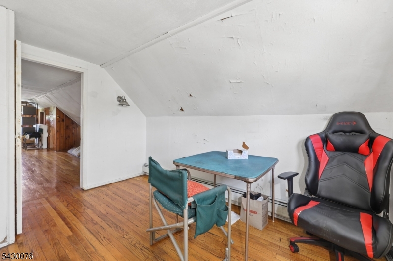 360 Rutherford Boulevard Clifton, NJ 07014 - Photo 27 of 42 a room with furniture and wooden floor