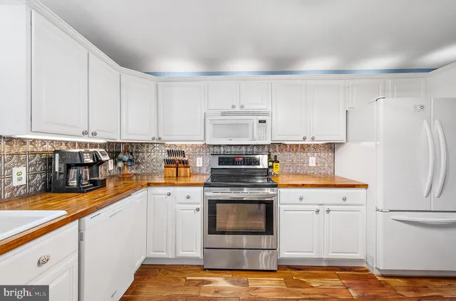 a bedroom with a bed and a television