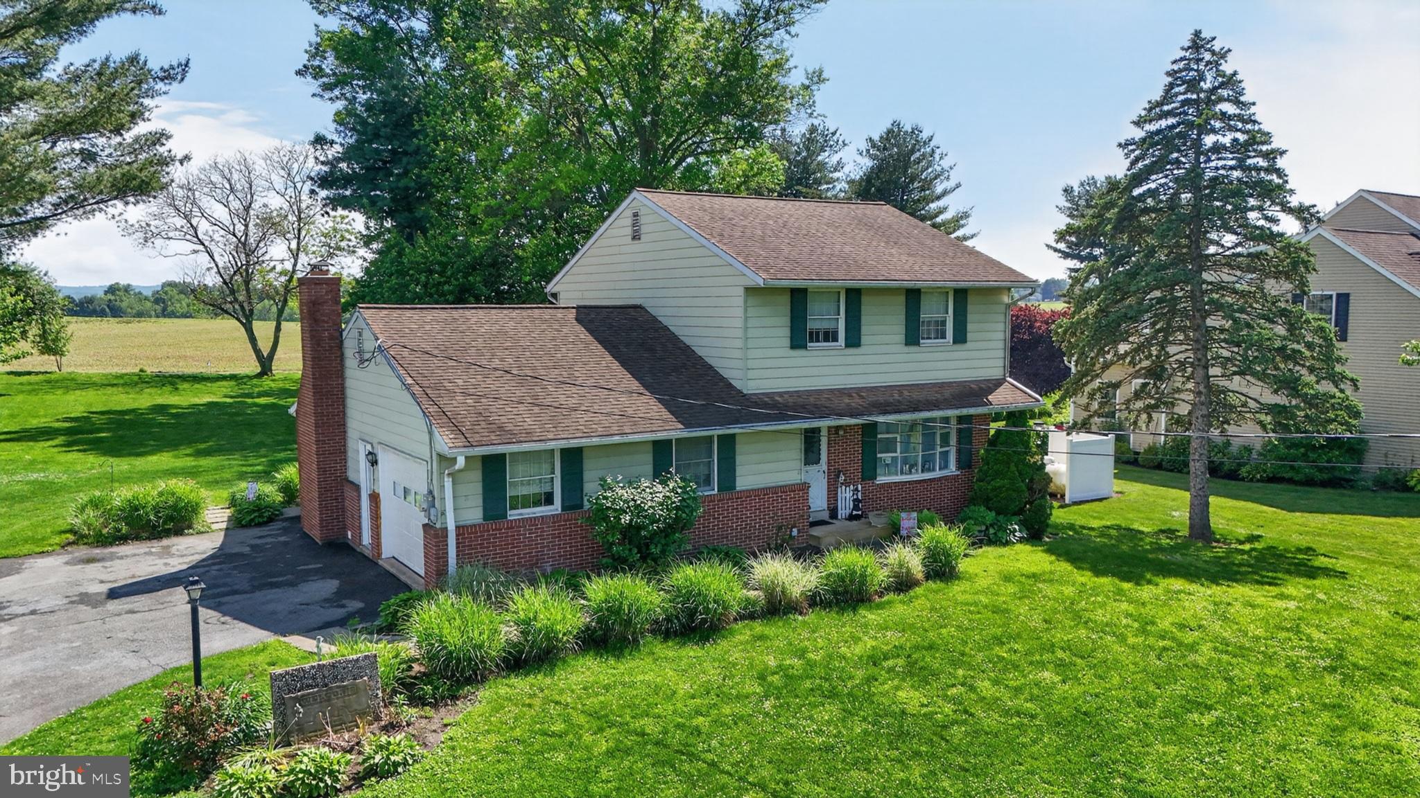 1106 Village Road Lancaster, PA 17602 - Photo 10 of 42 Charming home with lush green surroundings.