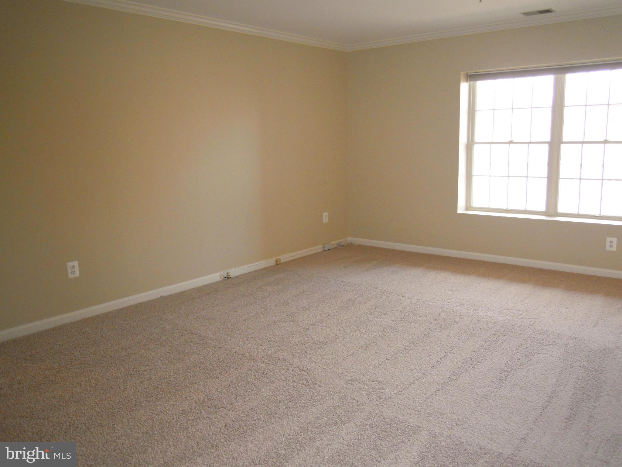 12000 Tralee Road, Unit 302 Lutherville-Timonium, MD 21093 - Photo 11 of 28 an empty room with a window