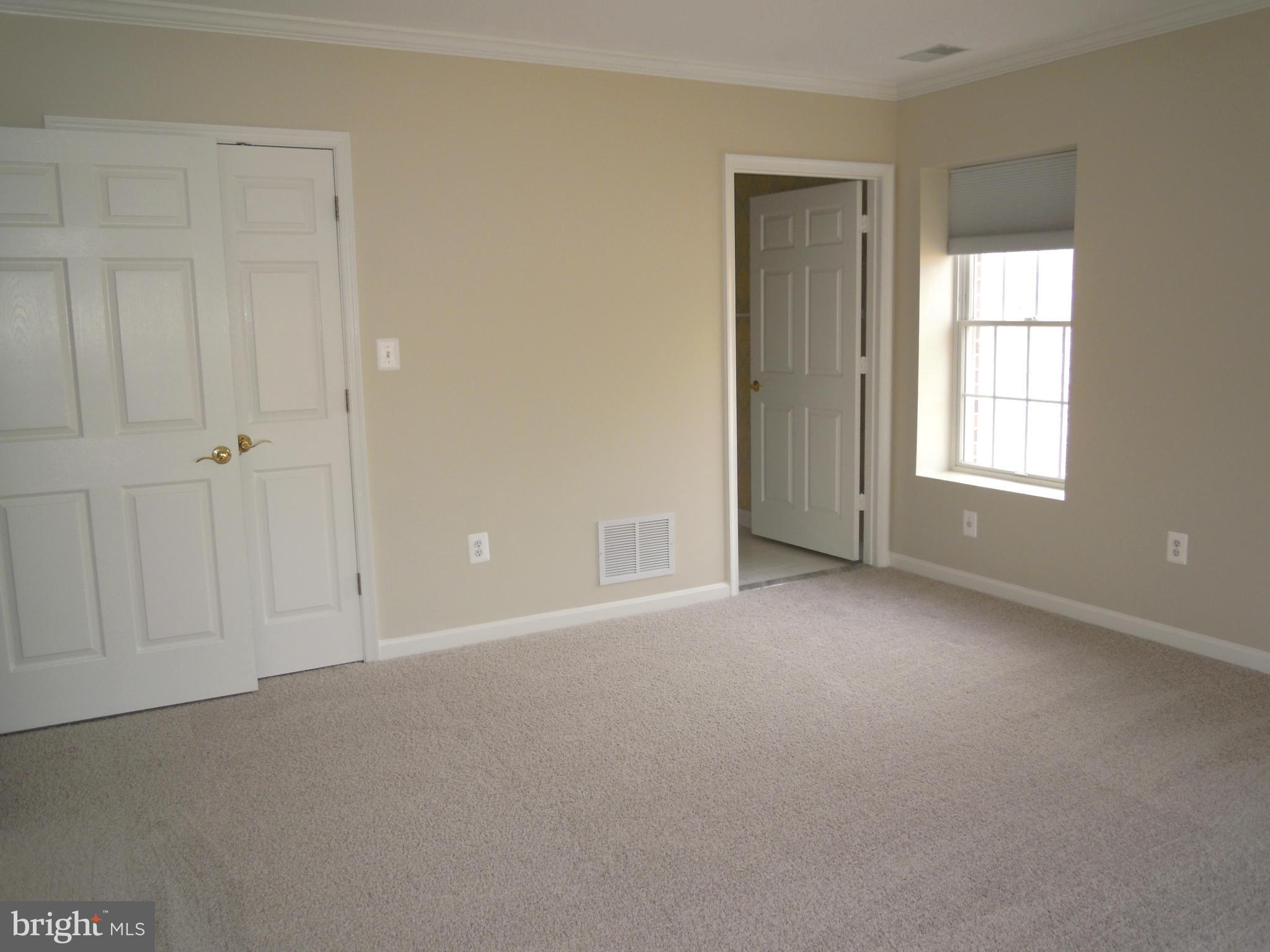 12000 Tralee Road, Unit 302 Lutherville-Timonium, MD 21093 - Photo 17 of 28 a view of an empty room with a window