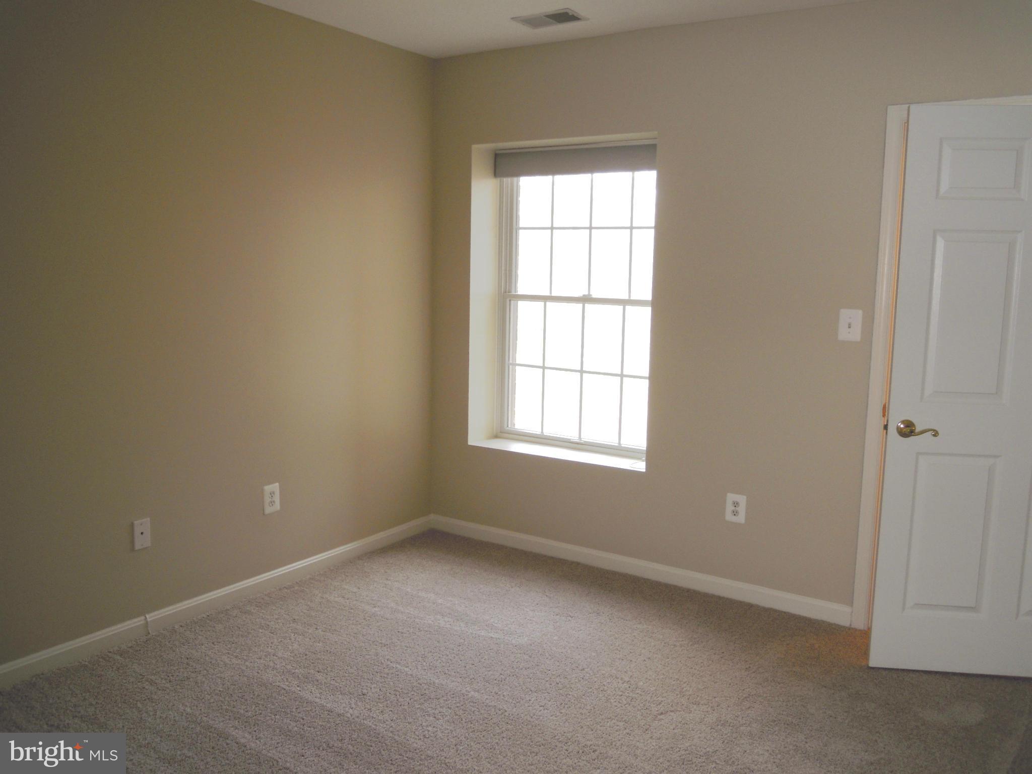 12000 Tralee Road, Unit 302 Lutherville-Timonium, MD 21093 - Photo 20 of 28 an empty room with a window