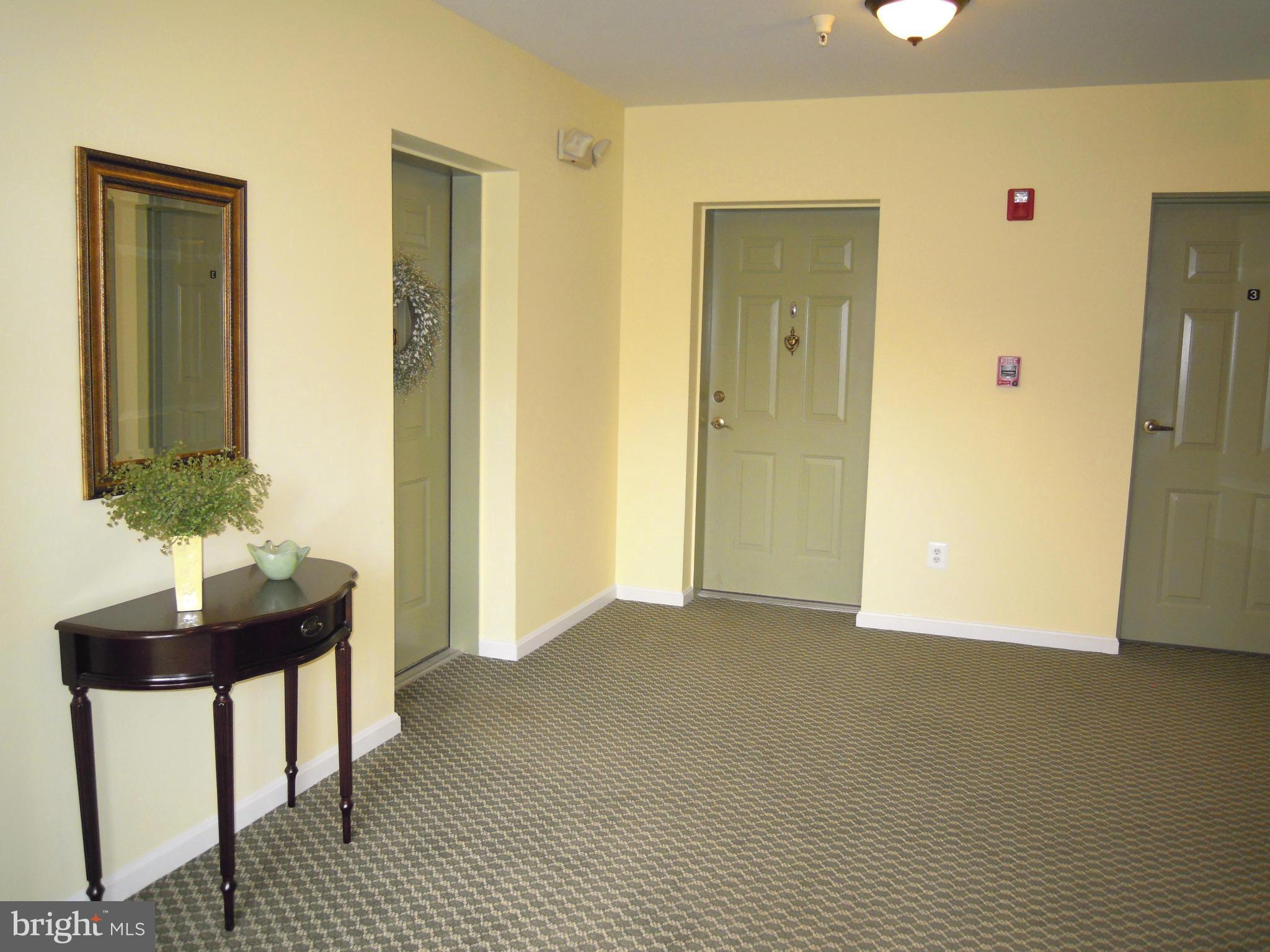 12000 Tralee Road, Unit 302 Lutherville-Timonium, MD 21093 - Photo 24 of 28 a view of a livingroom with furniture and wooden floor
