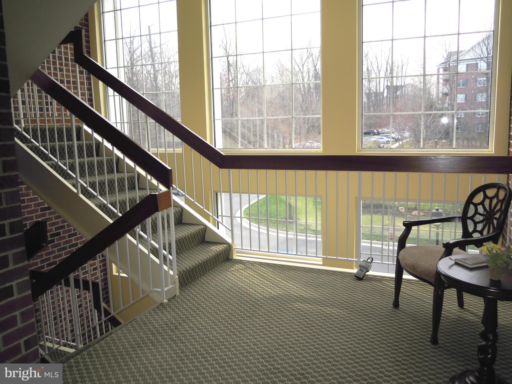 12000 Tralee Road, Unit 302 Lutherville-Timonium, MD 21093 - Photo 25 of 28 a view of entryway and hall with wooden floor