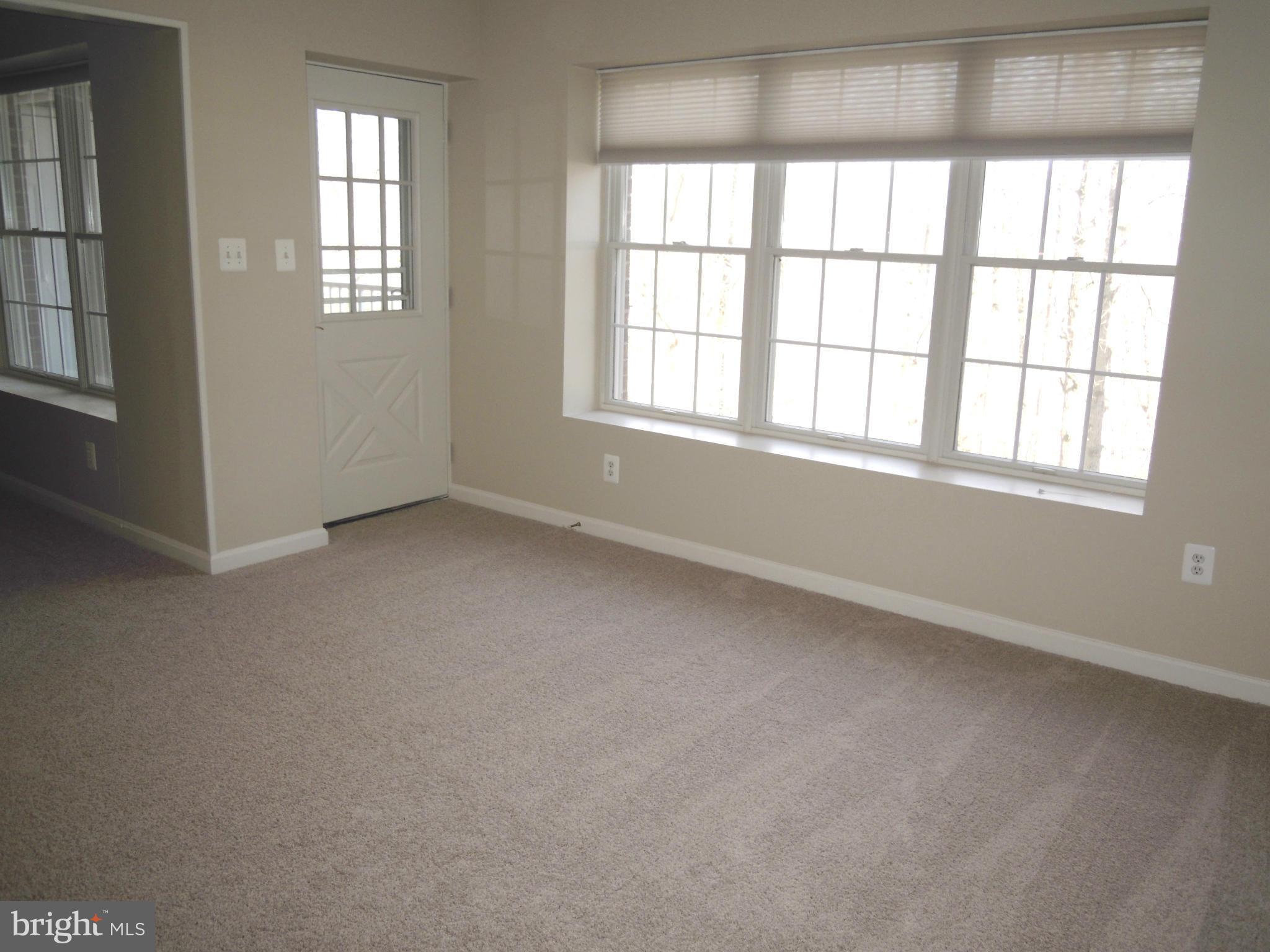 12000 Tralee Road, Unit 302 Lutherville-Timonium, MD 21093 - Photo 8 of 28 an empty room with a window