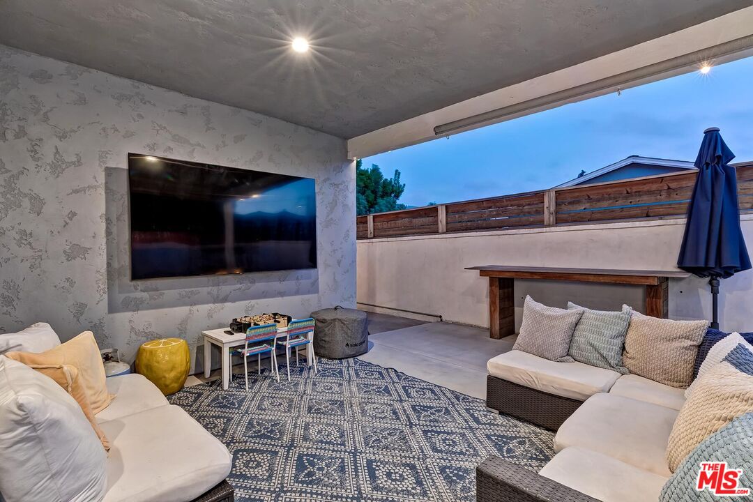 434 West Maple Avenue El Segundo, CA 90245 - Photo 26 of 29 a living room with furniture and a flat screen tv