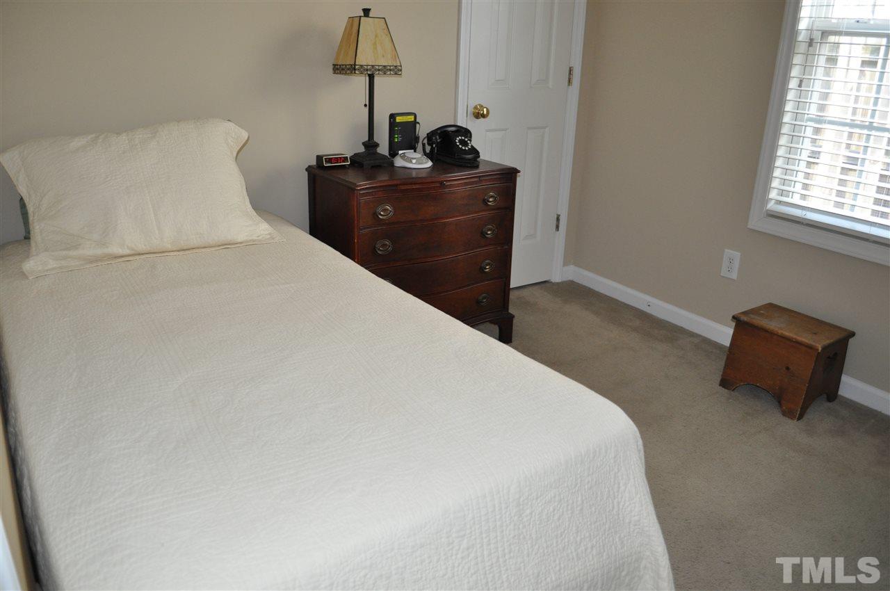 4904 Mocha Lane Raleigh, NC 27616 - Photo 11 of 15 a bedroom with a bed and window