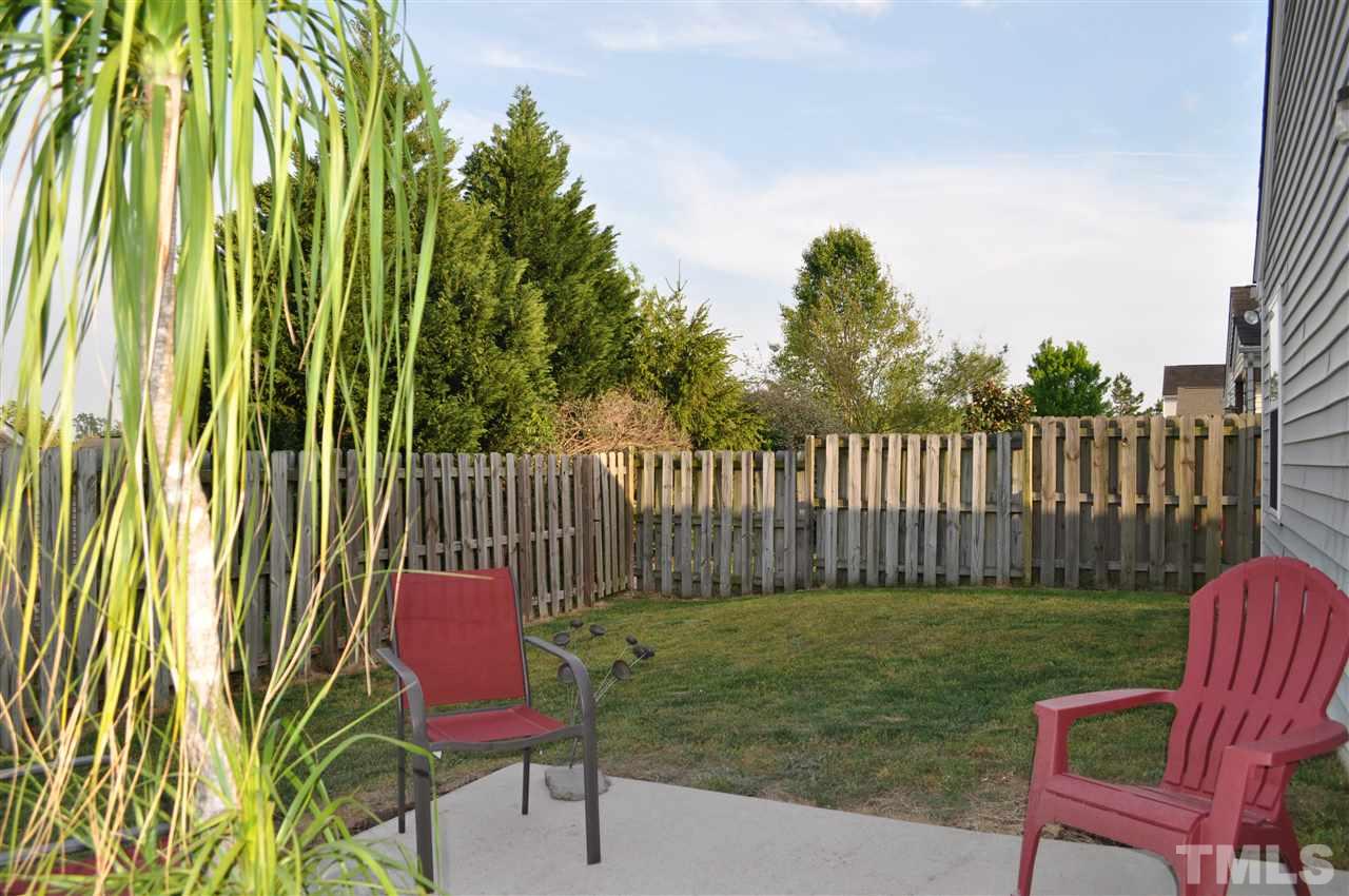4904 Mocha Lane Raleigh, NC 27616 - Photo 14 of 15 a view of a yard with a chair and a table and chair