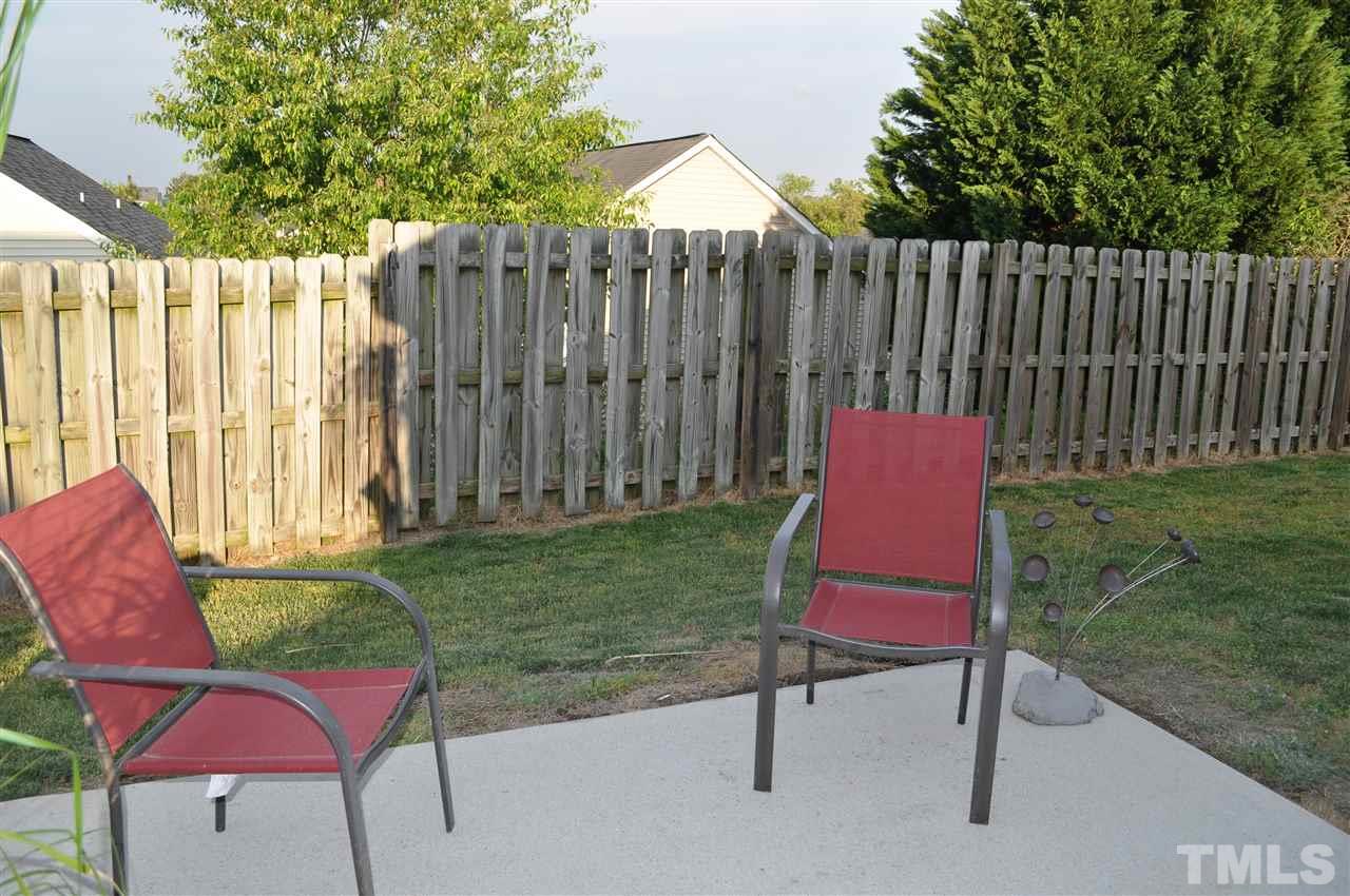 4904 Mocha Lane Raleigh, NC 27616 - Photo 15 of 15 a backyard of a house with table and chairs
