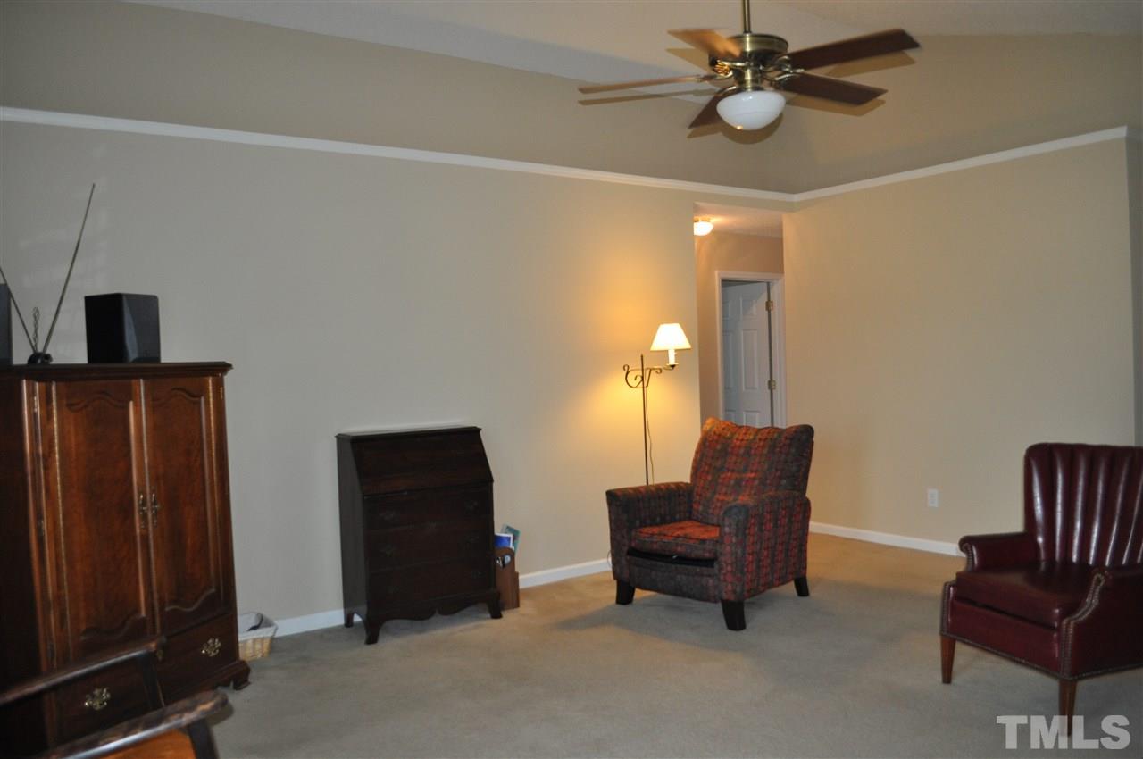 4904 Mocha Lane Raleigh, NC 27616 - Photo 4 of 15 a living room with furniture and a ceiling fan