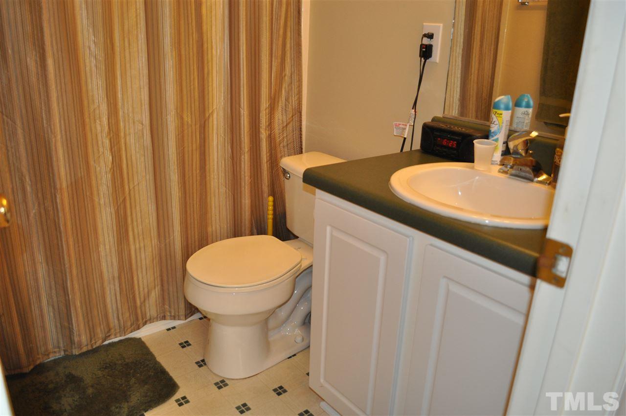 4904 Mocha Lane Raleigh, NC 27616 - Photo 9 of 15 a bathroom with a sink and toilet