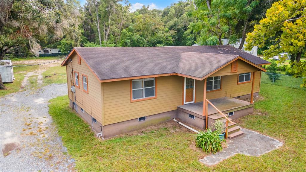 a aerial view of a house with a yard