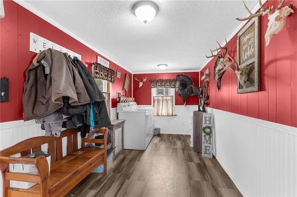 a view of an entryway with wooden floor