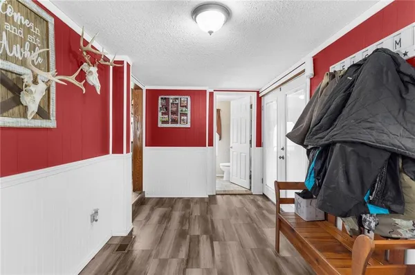 a view of front door with wooden floor