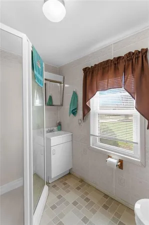 a kitchen with a refrigerator and window