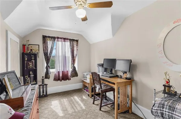 a bedroom with furniture and a window