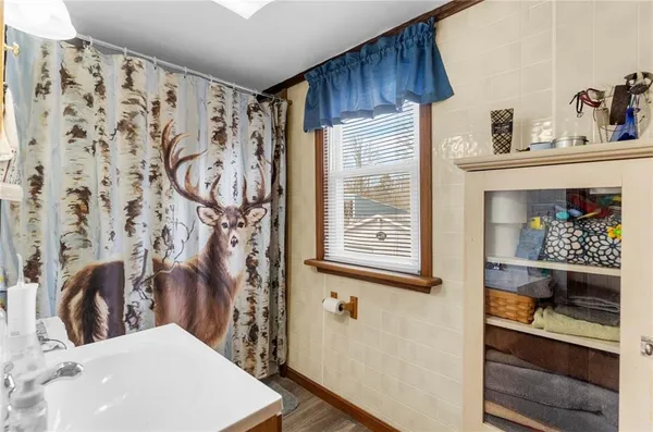 a bathroom with a bathtub and shower
