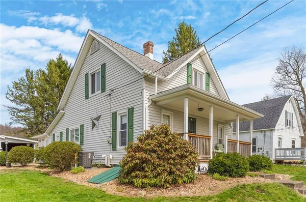 front view of a house with a yard