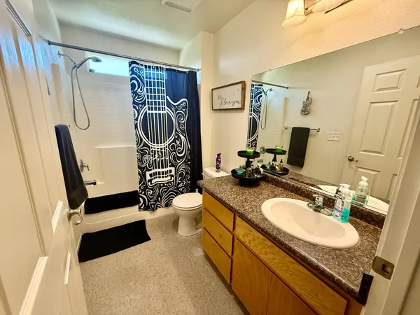 a bathroom with a sink double vanity and a mirror