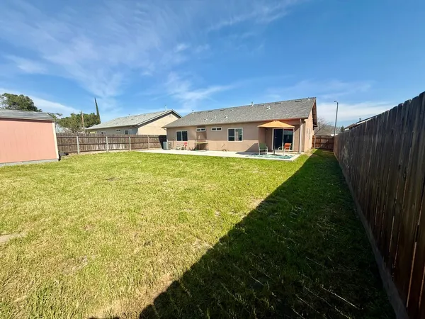 a house with yard in front of it