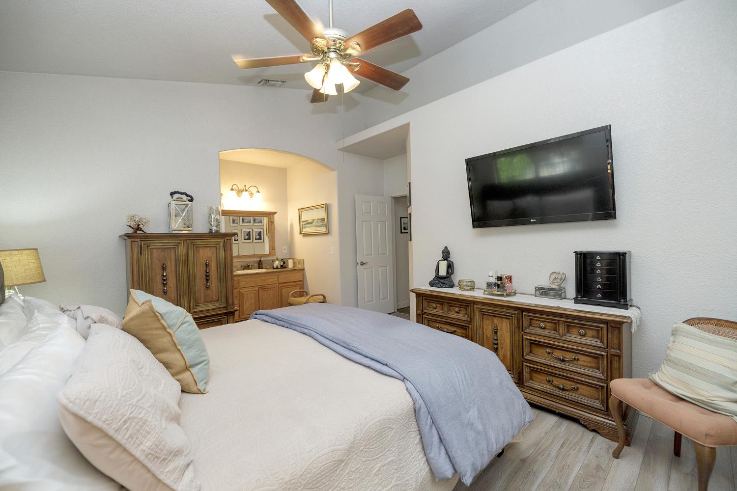 3731 Incline Way Riverbank, CA 95367 - Photo 22 of 49 a bedroom with a bed and a flat screen tv