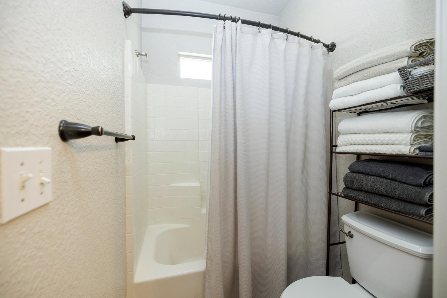 3731 Incline Way Riverbank, CA 95367 - Photo 24 of 49 a bathroom with a shower and a toilet