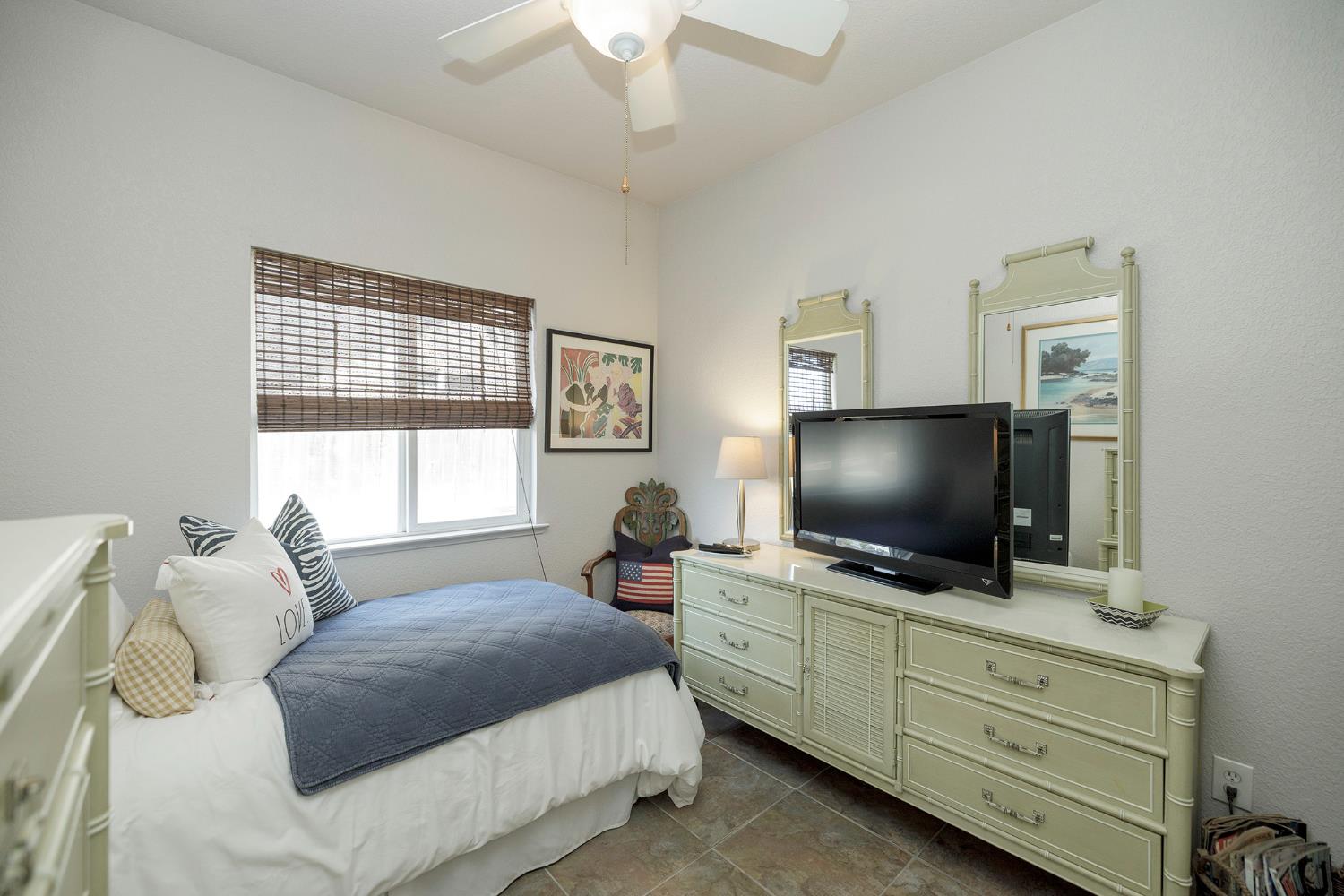 3731 Incline Way Riverbank, CA 95367 - Photo 26 of 49 a bedroom with a bed and a flat screen tv