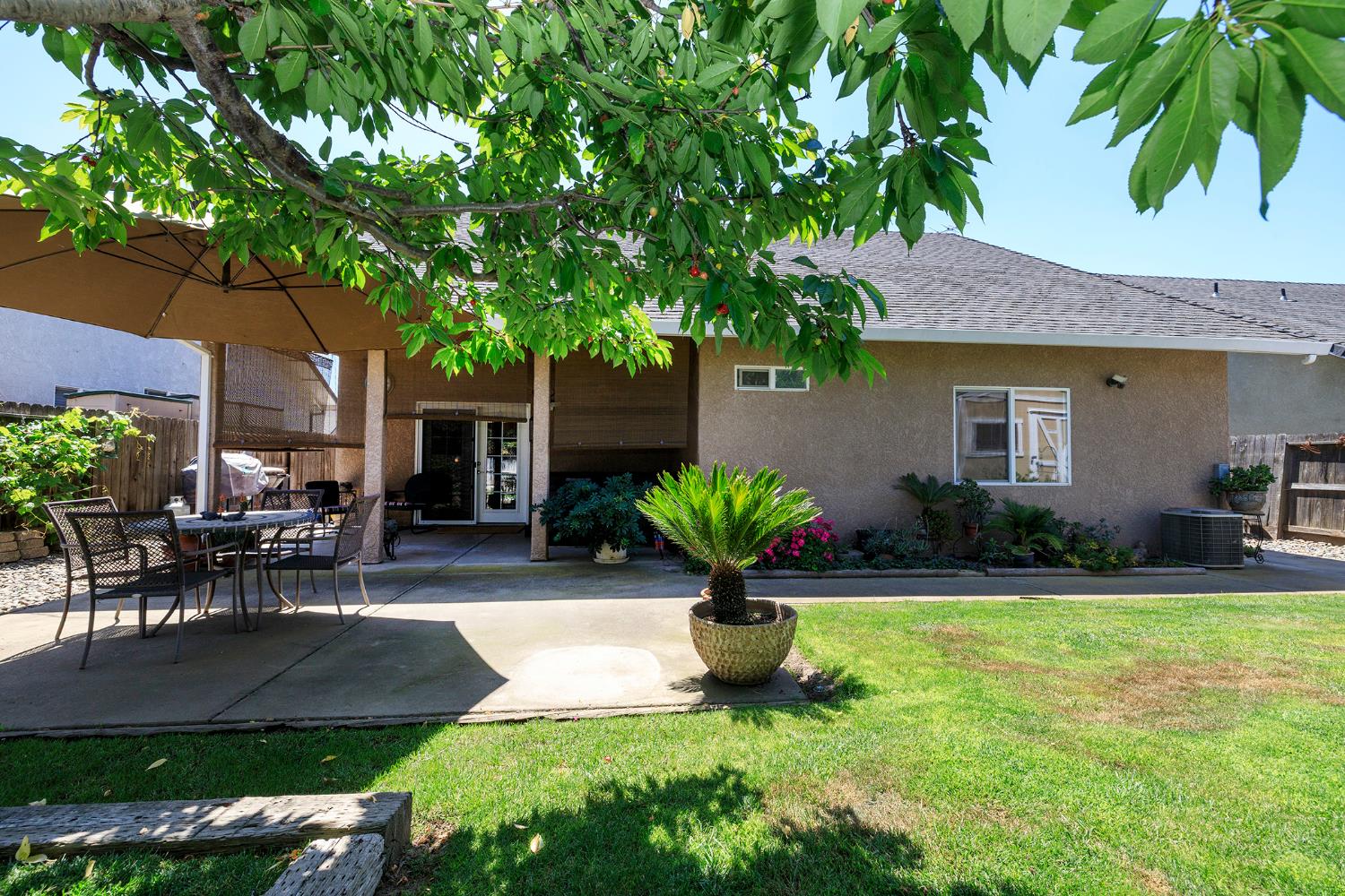 3731 Incline Way Riverbank, CA 95367 - Photo 40 of 49 a view of a house with backyard sitting area and garden