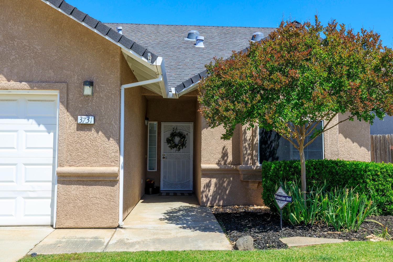 3731 Incline Way Riverbank, CA 95367 - Photo 4 of 49 a front view of a house with a yard