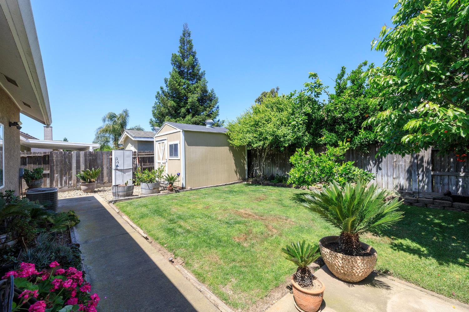 3731 Incline Way Riverbank, CA 95367 - Photo 45 of 49 a view of a backyard with plants and a garden