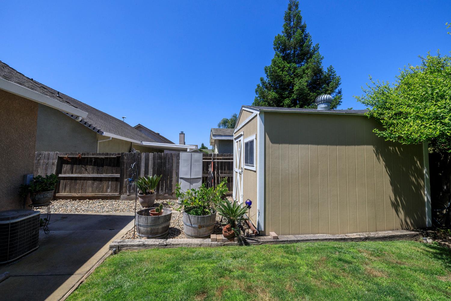 3731 Incline Way Riverbank, CA 95367 - Photo 48 of 49 a view of a backyard with plants and a patio