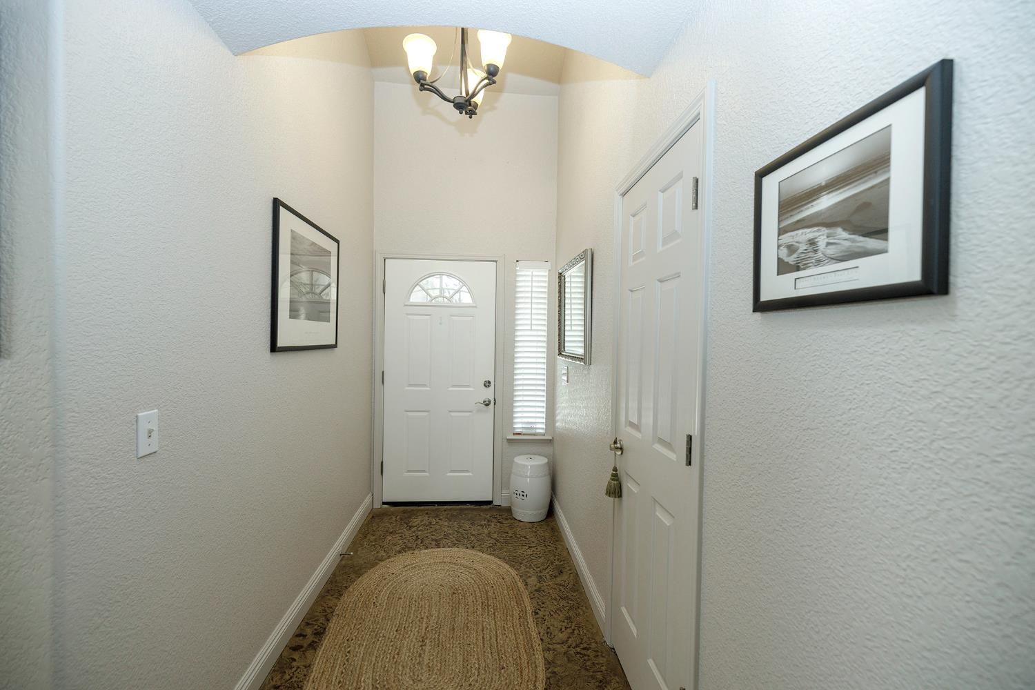 3731 Incline Way Riverbank, CA 95367 - Photo 6 of 49 a view of a hallway with a flower pot
