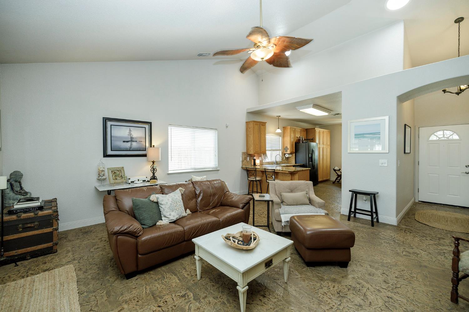 3731 Incline Way Riverbank, CA 95367 - Photo 8 of 49 a living room with furniture a rug and a chandelier