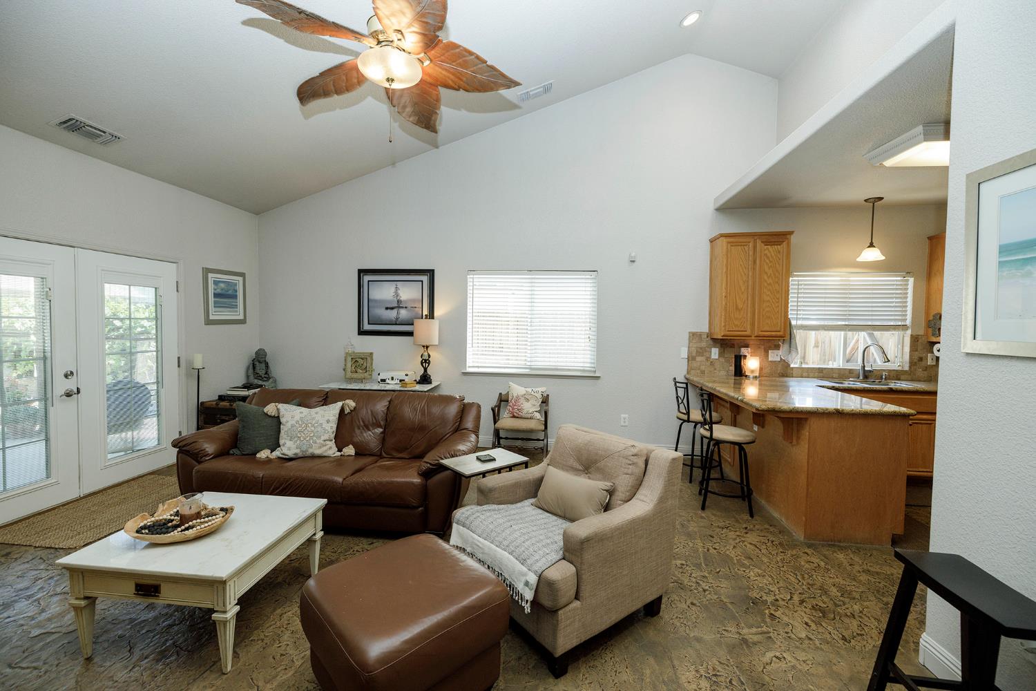 3731 Incline Way Riverbank, CA 95367 - Photo 9 of 49 a living room with furniture a rug and a chandelier