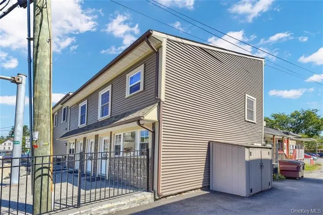 a view of a house with parking space