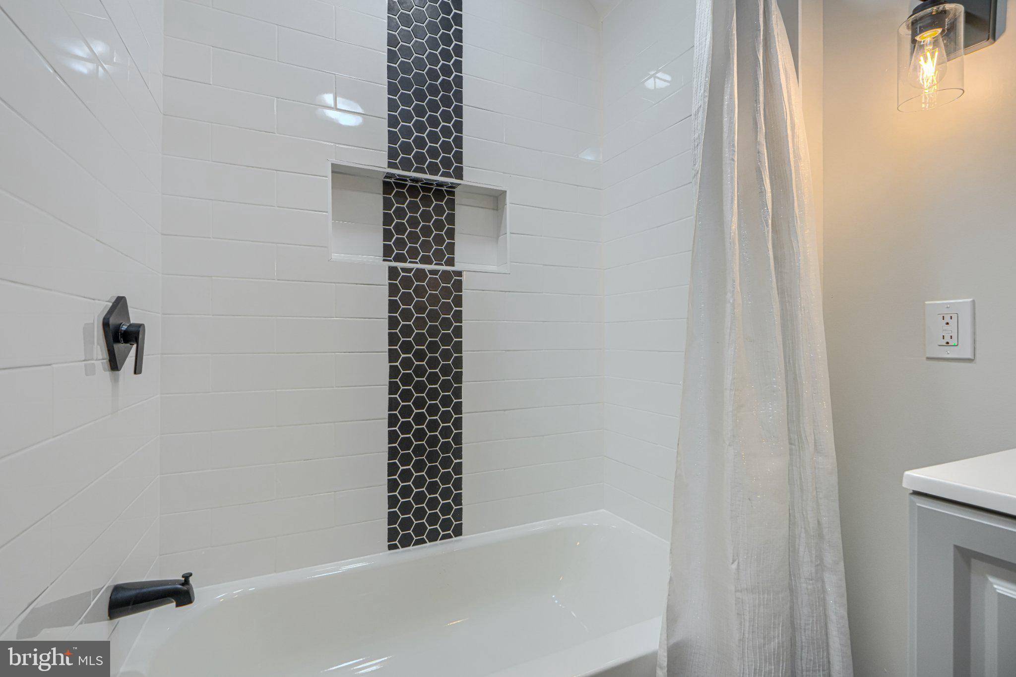 143 Rigdon Road Aberdeen, MD 21001 - Photo 36 of 57 Sleek modern bathroom with stylish tiles.