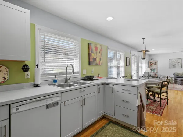 a kitchen with a sink and cabinets