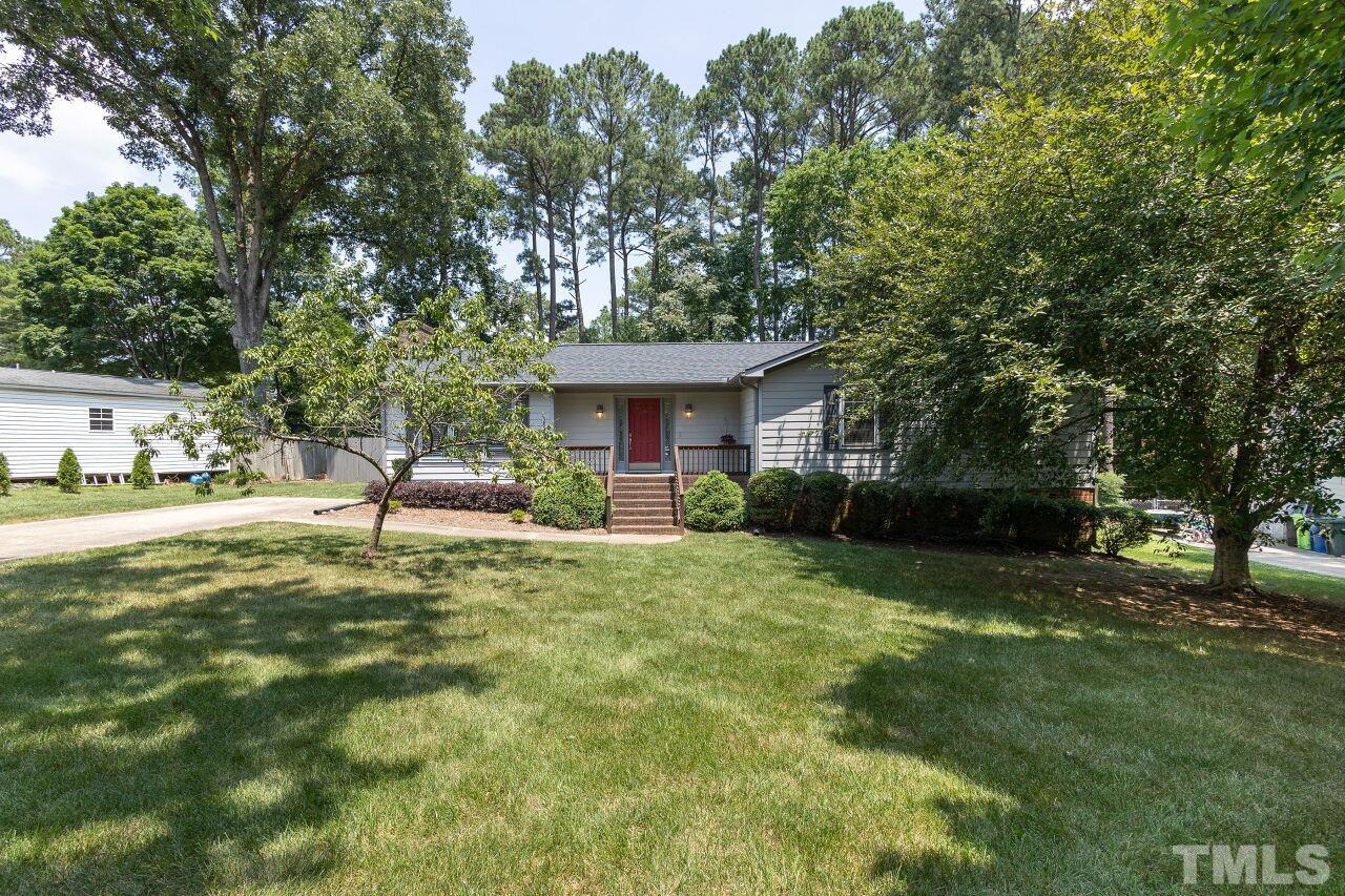 4808 Waybridge Court Raleigh, NC 27606 - Photo 1 of 29 a house with garden in front of it