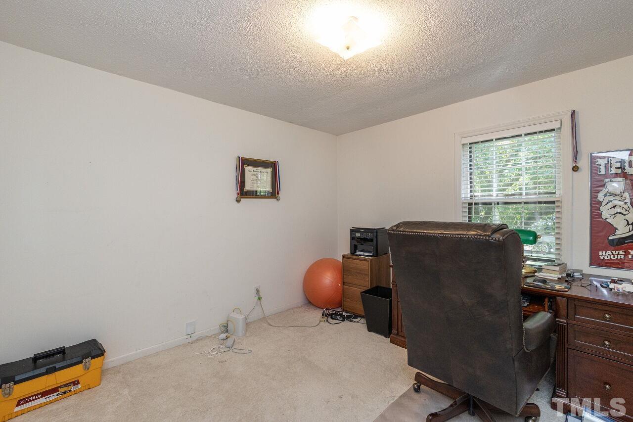 4808 Waybridge Court Raleigh, NC 27606 - Photo 21 of 29 a room with furniture and windows