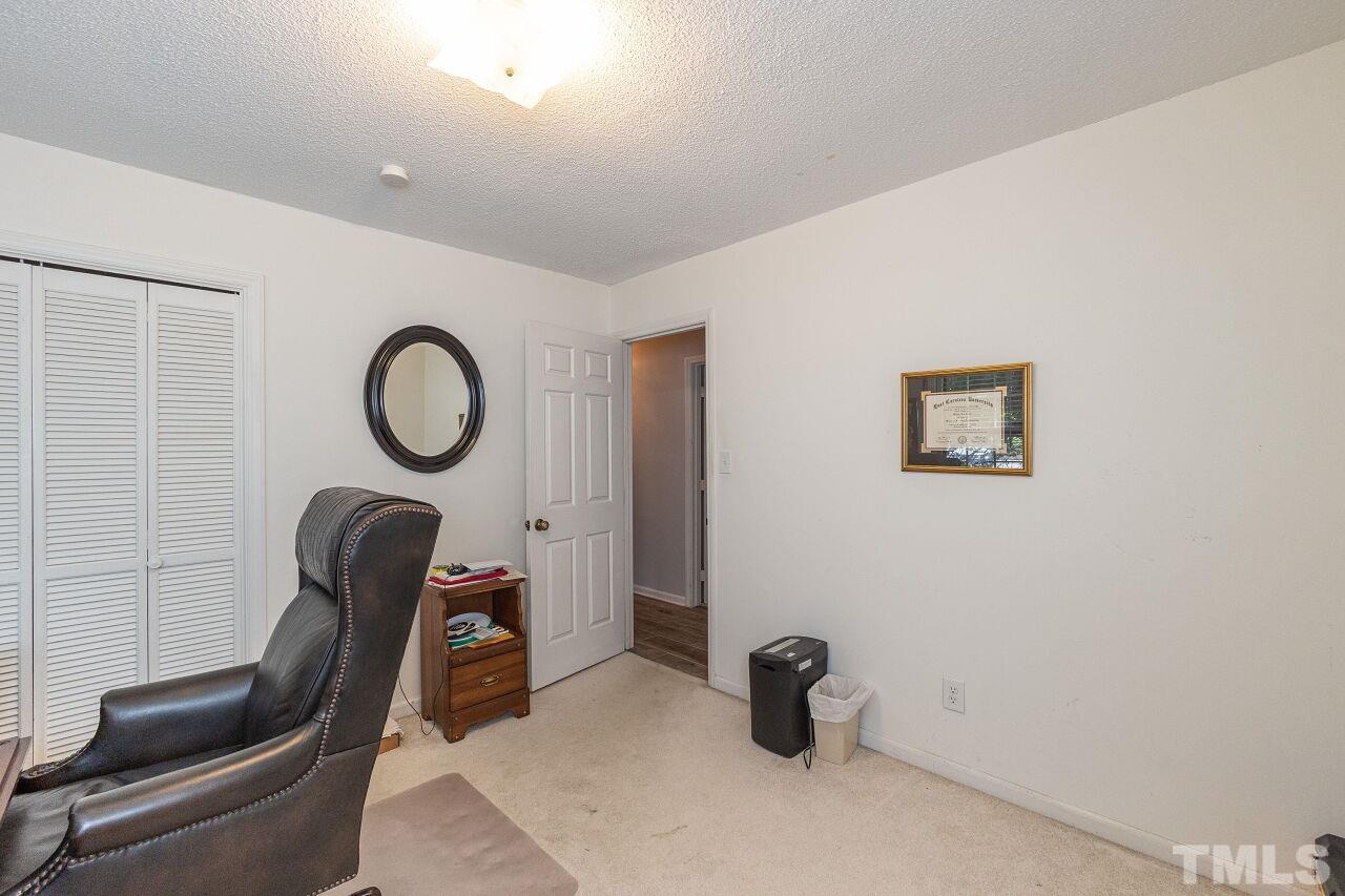 4808 Waybridge Court Raleigh, NC 27606 - Photo 22 of 29 view of a livingroom with furniture and a window