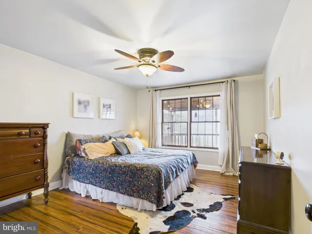 a view of a chairs and fire pit in the backyard